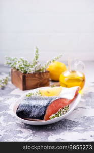 raw salmon with spice and salt on the plate