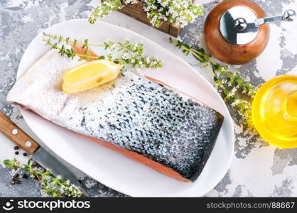 raw salmon with spice and salt on the plate