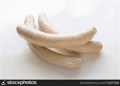 Raw sausages in isolated in white.. Raw sausages in isolated in white