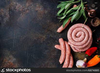 raw sausages with spice on a table