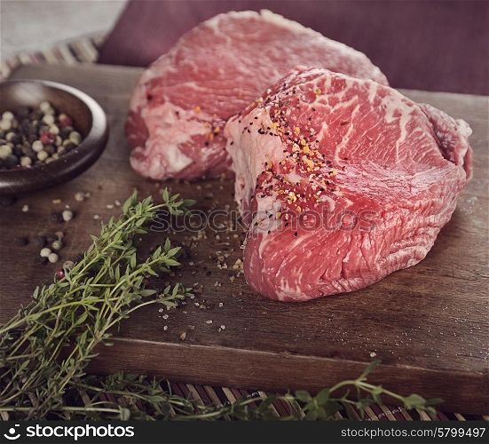 Raw Sirlion Steaks with Hirbs and Spices