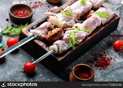 Raw spicy meat shish kebab on a cutting board.Skewer set of meat. Raw kebab from meat