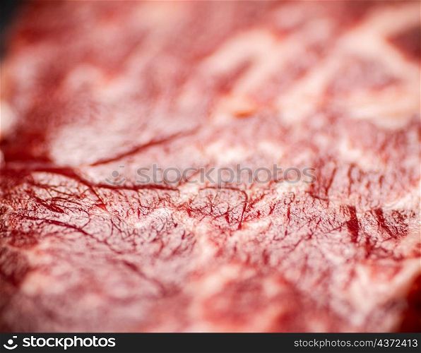 Raw steak. Macro background. The texture of the meat. High quality photo. Raw steak. Macro background. The texture of the meat.
