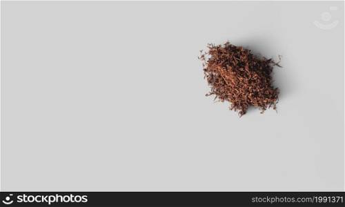 Raw tobacco against white background.top up view