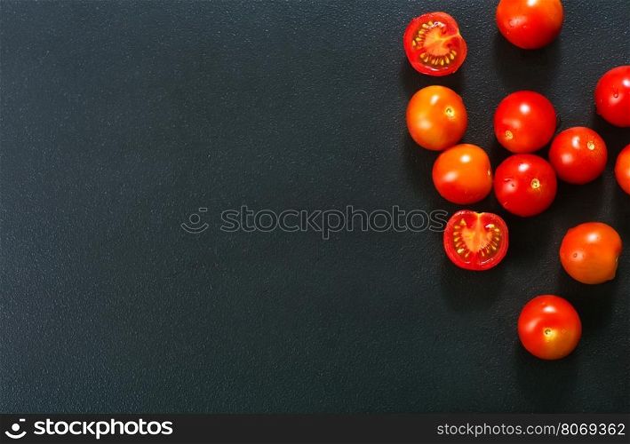 raw tomato cherry on the black table