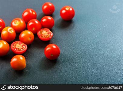 raw tomato cherry on the black table