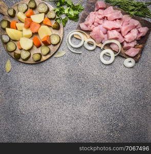 raw turkey with tomato sauce, pepper, spices, herbs ingredients for stew on wooden rustic background top view close up border ,place for text