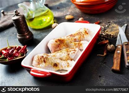 Raw uncooked chicken legs, meat with ingredients for cooking. Raw uncooked chicken legs, drumsticks in bowl, meat with ingredients for cooking