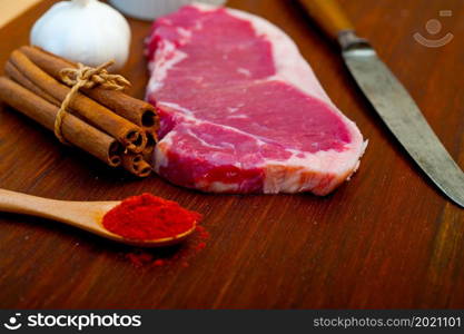 raw uncooked ribeye beef steak butcher selection