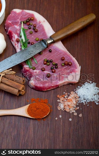 raw uncooked ribeye beef steak butcher selection