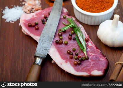 raw uncooked ribeye beef steak butcher selection