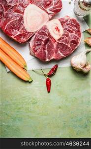 Raw veal shank meat and ingredients for Osso Buco cooking on rustic background, top view, vertical border