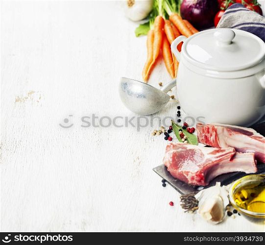 Raw vegetables and meat set with herbs and spices, ingredient for broth or soup, food background