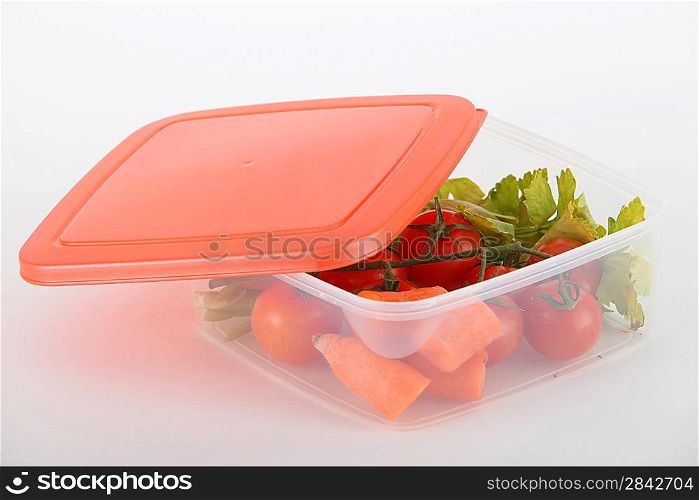 Raw vegetables in a plastic container
