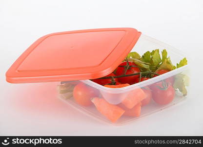 Raw vegetables in a plastic container