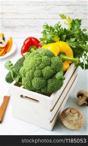 Raw vegetables on a table. Fresh pepper broccoli and other vegetables