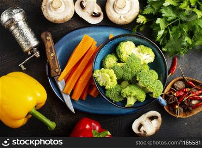 Raw vegetables on a table. Fresh pepper broccoli and other vegetables