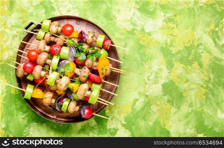 Raw vegetables on skewers. Raw diet kebab from fresh vegetables on skewers. Vegetables for grilling