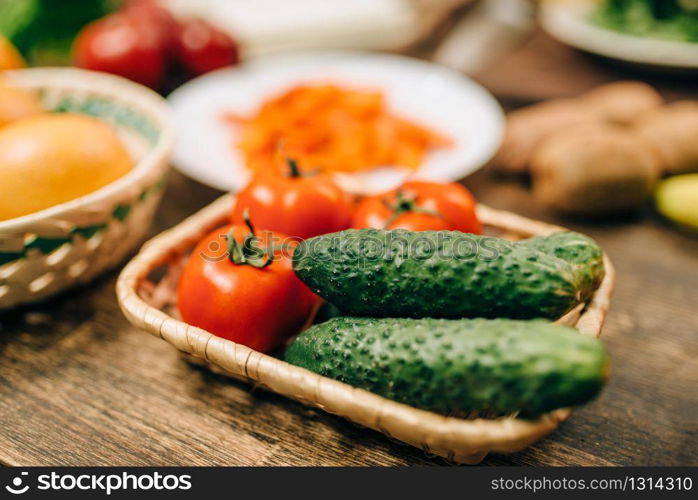 Raw vegetables on wooden table closeup, nobody. Healthy food concept