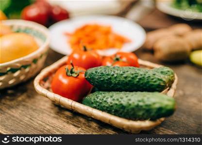 Raw vegetables on wooden table closeup, nobody. Healthy food concept