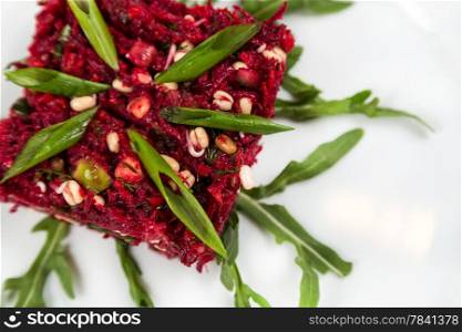 raw vegetarian salad with beetroot and greensprouting seed