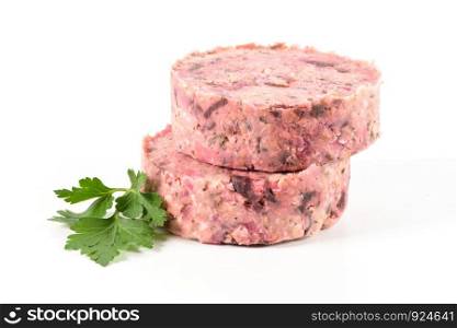 Raw veggie burger with beetroot and white beans with parsley leaves on white background.