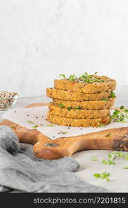 Raw veggie burger with lentils, vegetables and thyme leaves on kitchen countertop. Top view. Flat lay