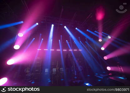 rays of light illuminate the scene at the concert.