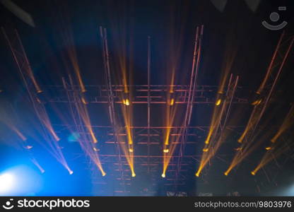 rays of light illuminate the scene at the concert.