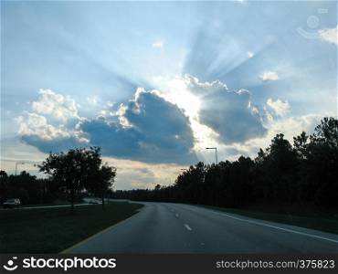 Rays of sunshine coming out of a cloud