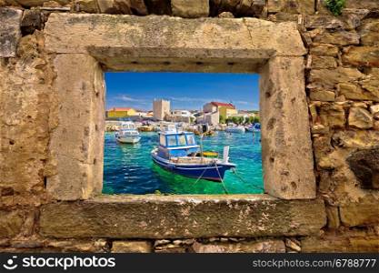 Razanac turquoise waterfront through stone window, Dalmatia, Croatia
