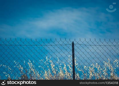 Razor and barbed wire fence. Forbidden place