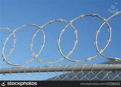 Razor wire at the top of a security fence