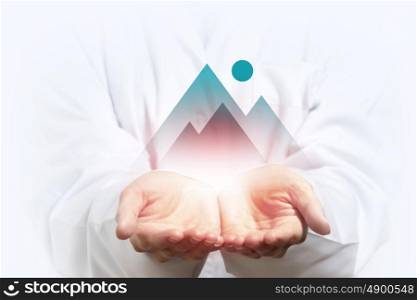 Reach your top. Close up of businesswoman hand holding digital icon in palm