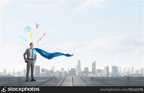 Reaching top of success. Young confident super businessman standing on top of building