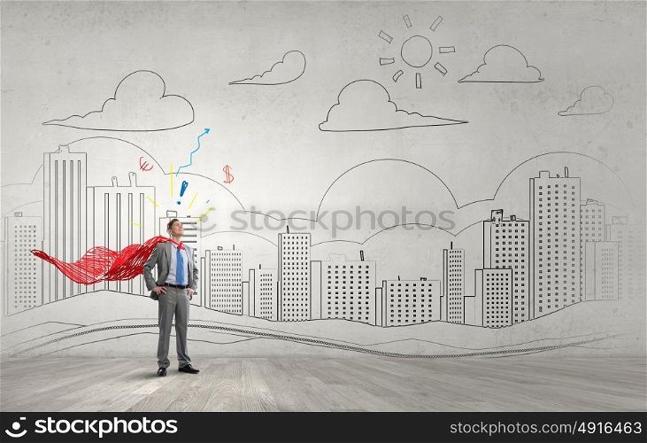 Reaching top of success. Young confident super businessman with cape behind back