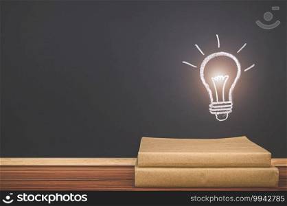  Read a book concept light bulb symbol on the blackboard represents an idea