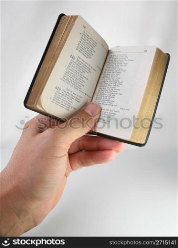 reading a book :hand holding an open book