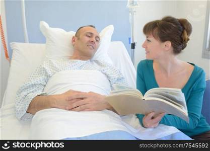 reading a book to a patient