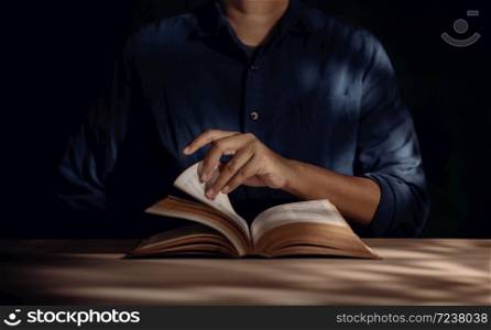 Reading Book Concept, Person Sitting on Desk and Opening a Book. Learning and Education