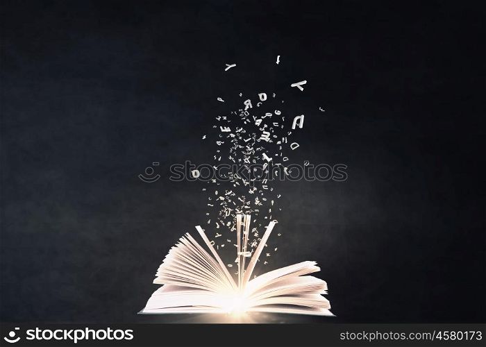 Reading books concept. Close up of hand holding in palm glowing book