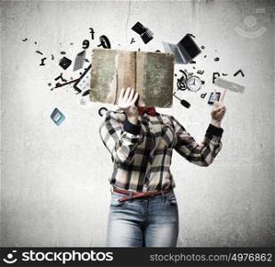 Reading concept. Woman in casual wear hiding her face behind book