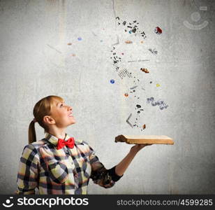 Reading concept. Woman in casual wear holding opened book in hands