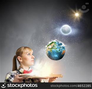 Reading concept. Woman in casual wear holding opened book in hands. elements of this image are furnished by NASA