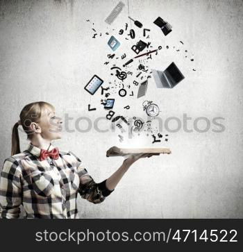 Reading concept. Woman in casual wear holding opened book in hands