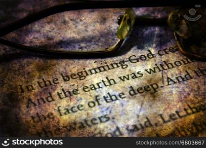 Reading glasses on bible grunge concept