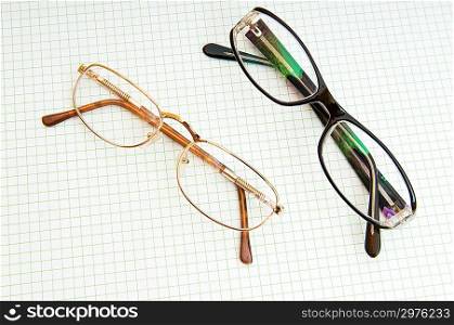 Reading glasses on the black page