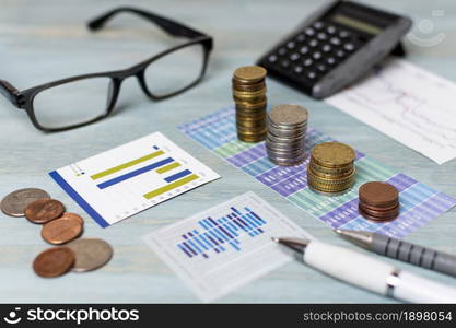 reading glasses piles coins high view. Resolution and high quality beautiful photo. reading glasses piles coins high view. High quality beautiful photo concept