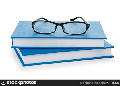 Reading glasses with books isolated on the white