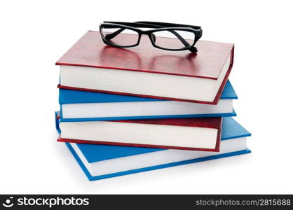 Reading glasses with books isolated on the white